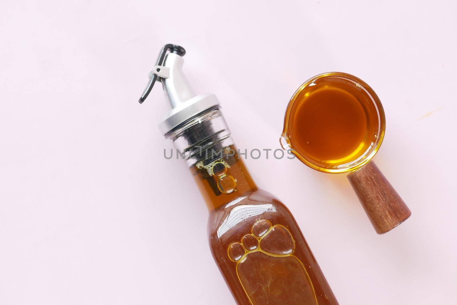 Mustard Seed Oil in a glass jar on table ,