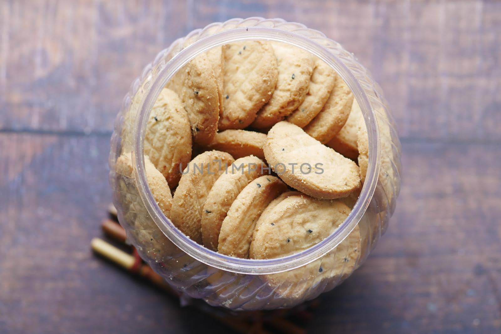 close up of sweet cookies on wooden table .