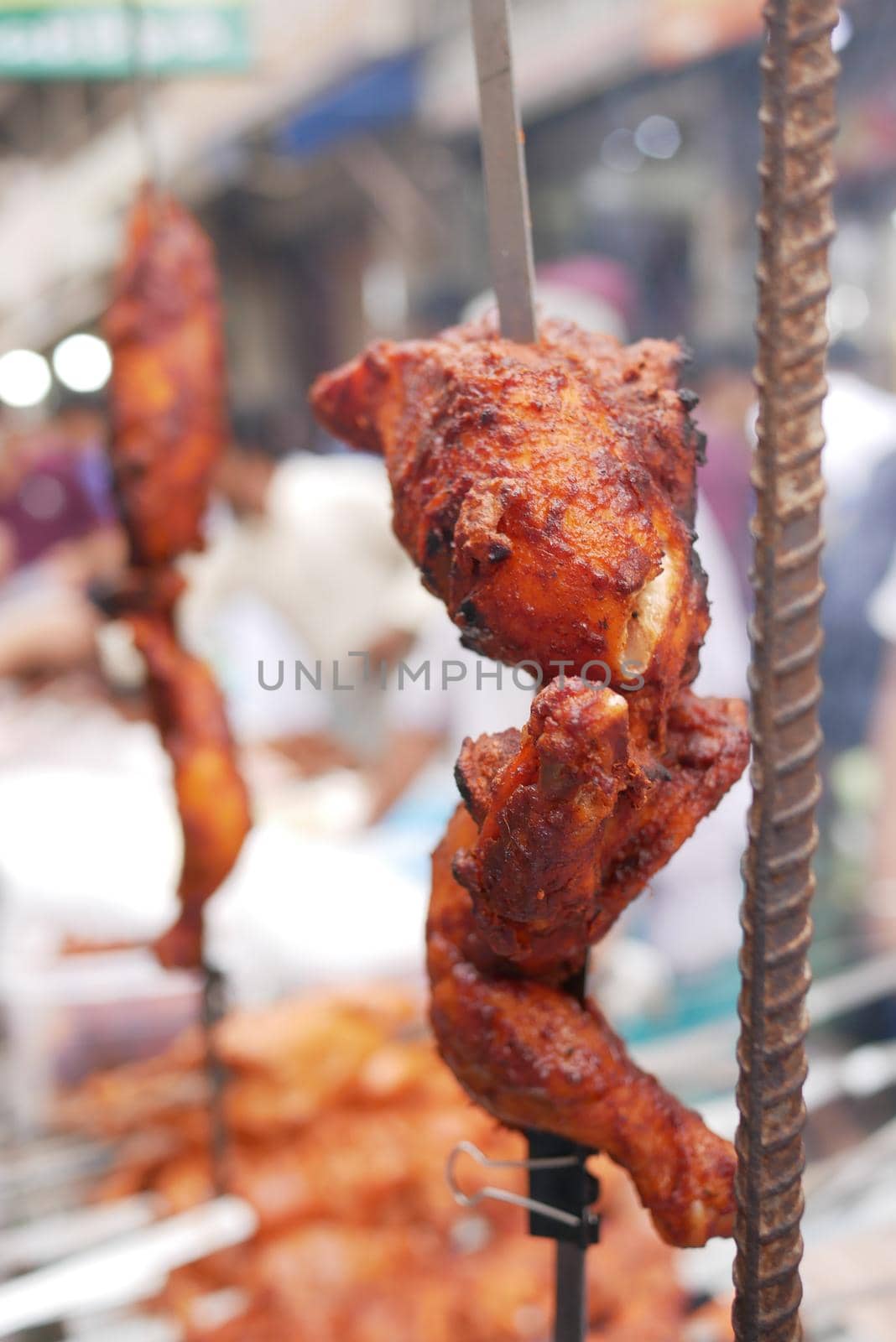 close up of slice of grill chicken display for sale .