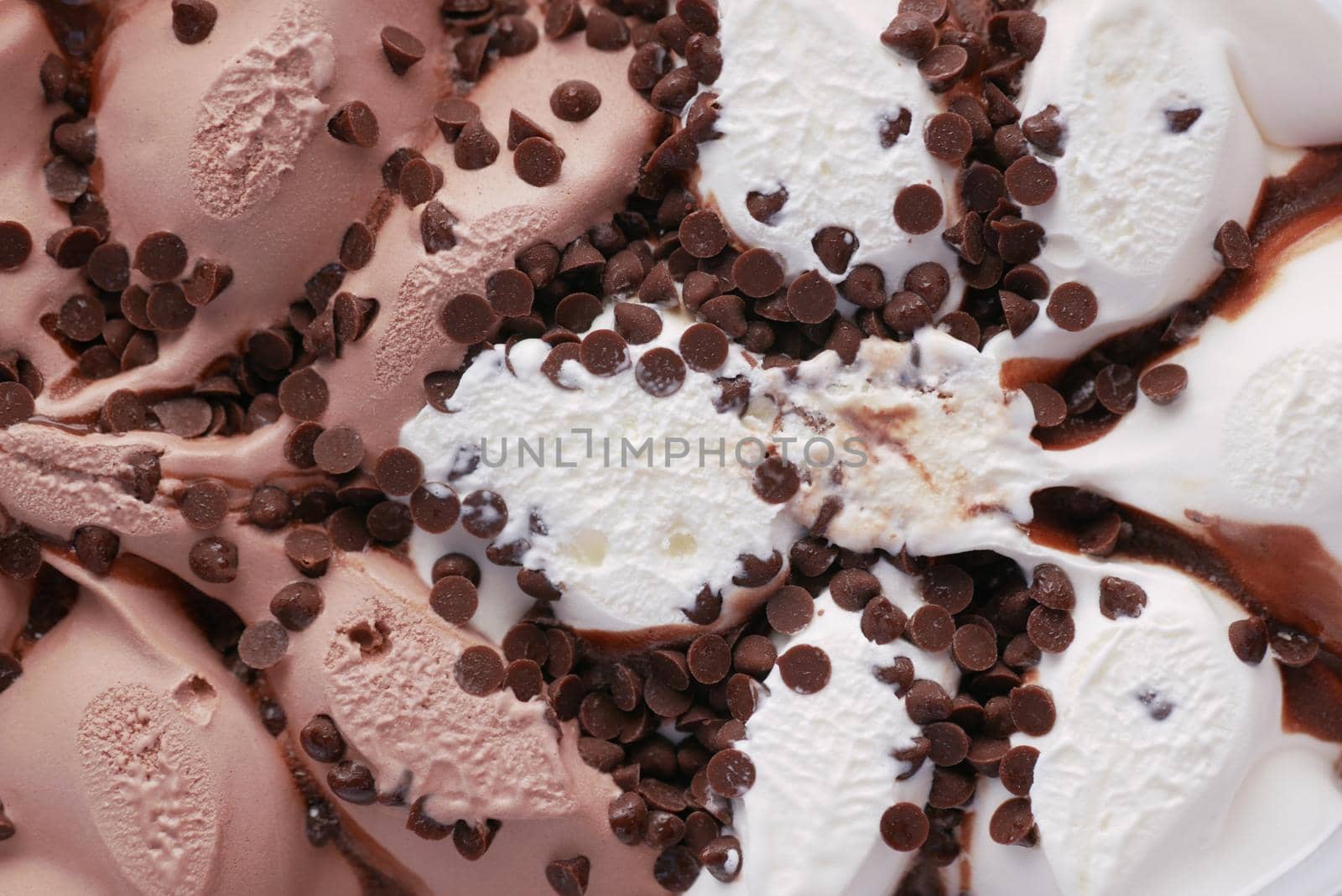 close up of vanila flavor ice cream in a container .