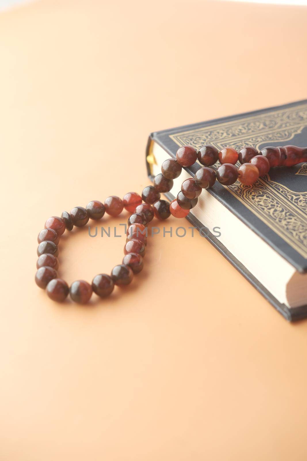 Holy book Quran and rosary on table, close up. by towfiq007