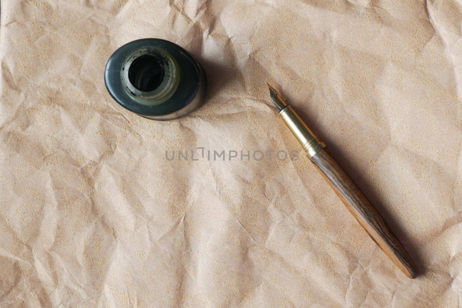 old empty paper and fountain pen on table .