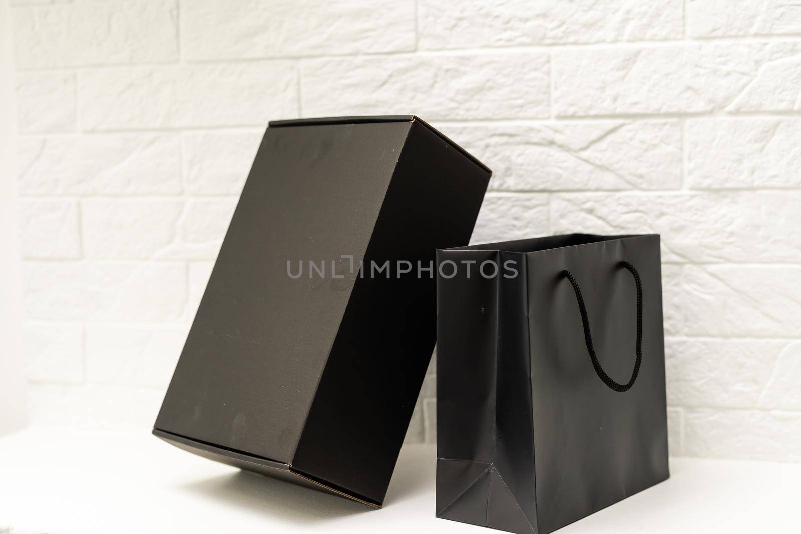 black gift box on white background. by Andelov13