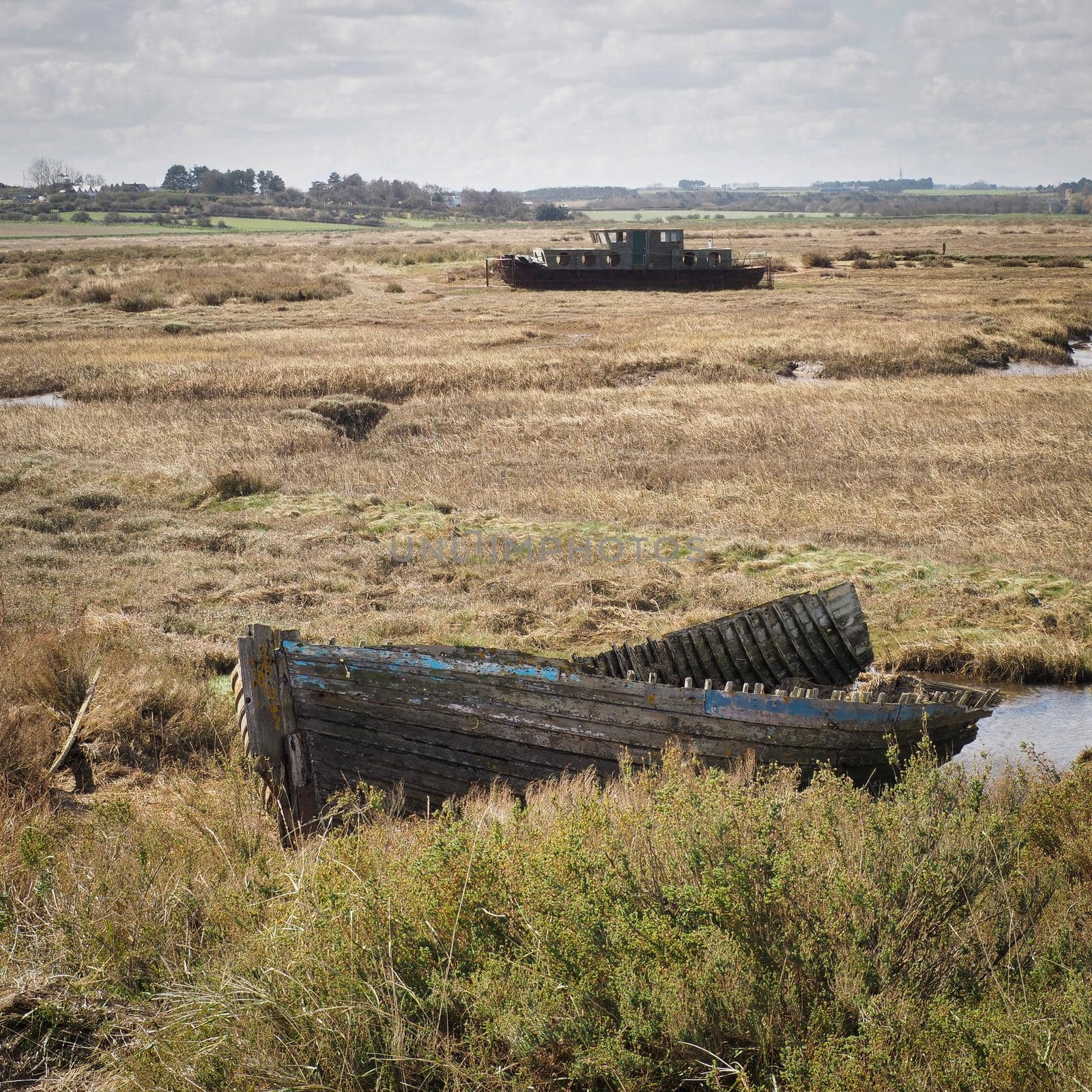 Boat wrecks on the salt marshes, Blakeney National Nature Reserve, Norfolk by PhilHarland