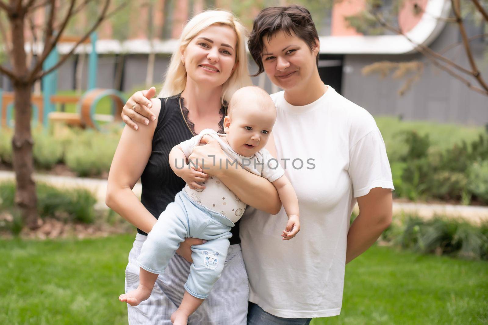 Happy Family Posing for A Portrait in the Park