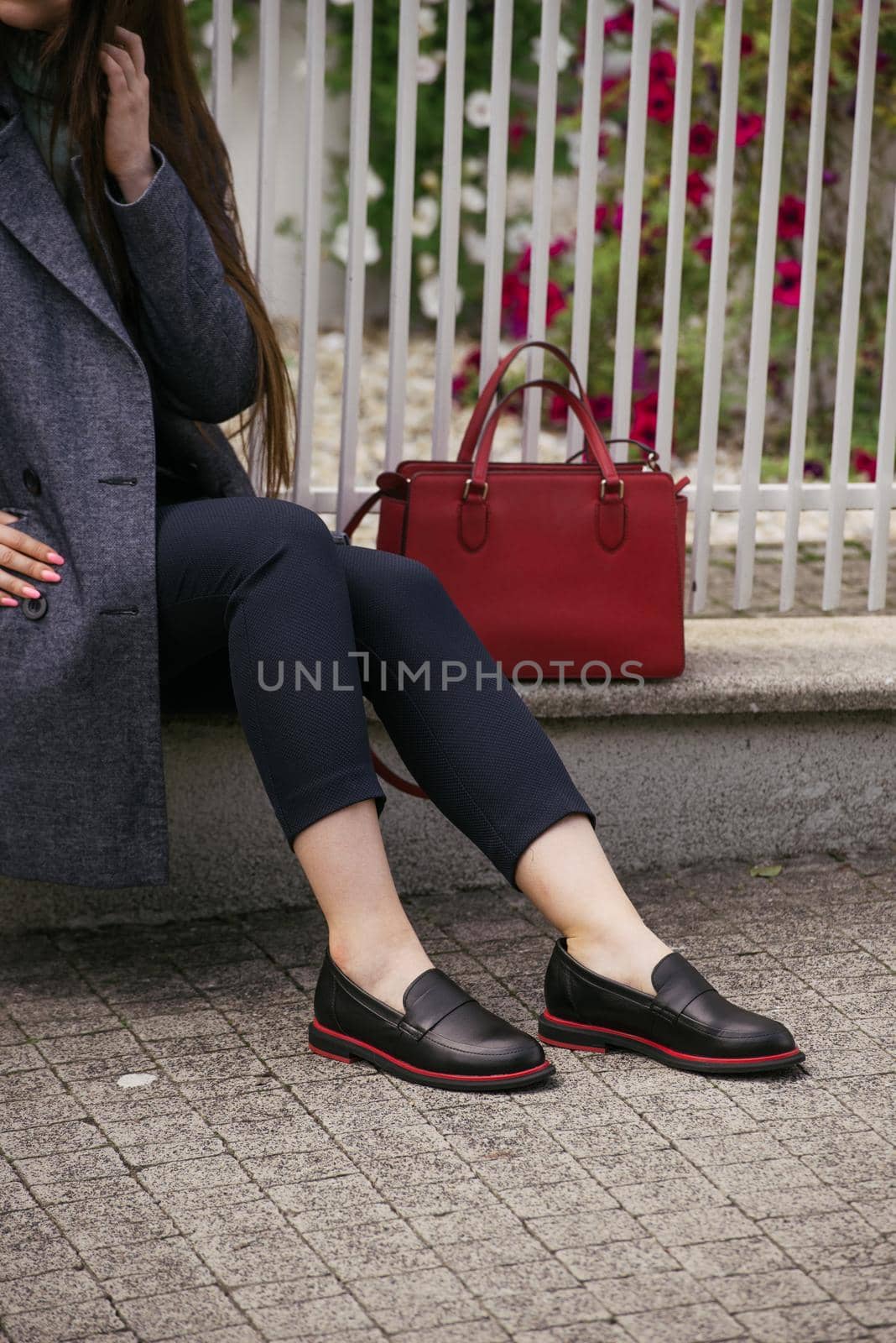 Female fashion concept. Outdoor portrait of a young beautiful business woman posing on the street. Model wearing stylish clothes. by Ashtray25