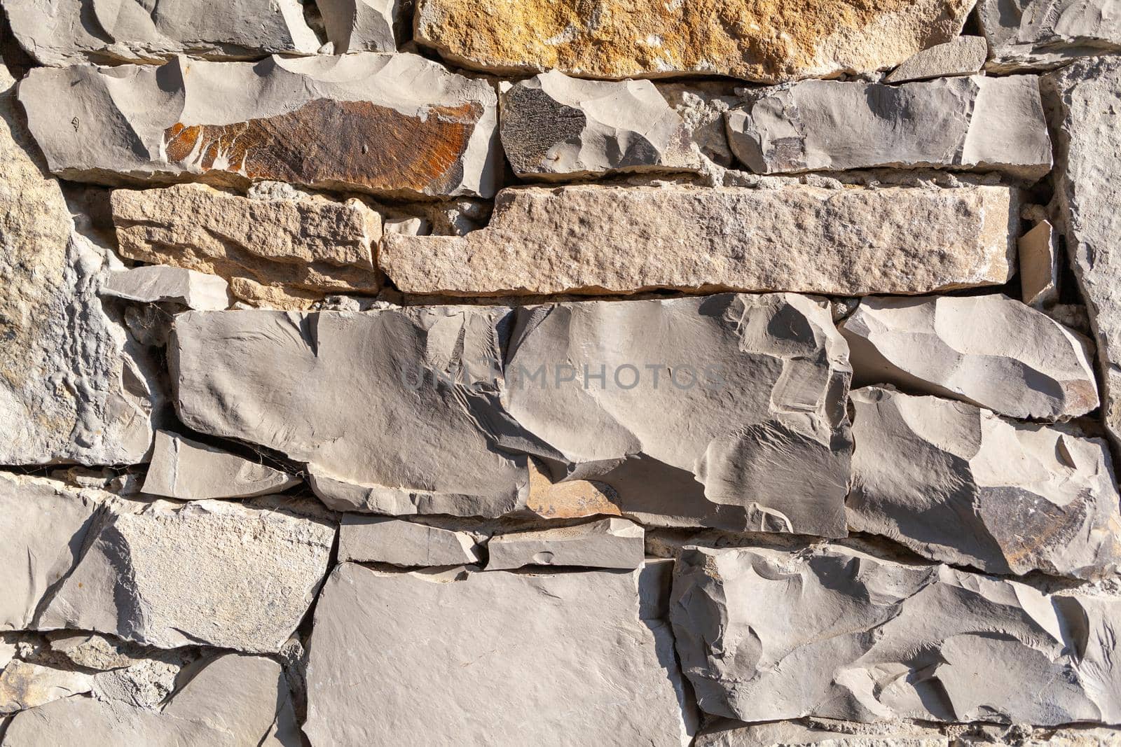 Texture of a stone wall. Old castle stone wall texture background.  by AnatoliiFoto