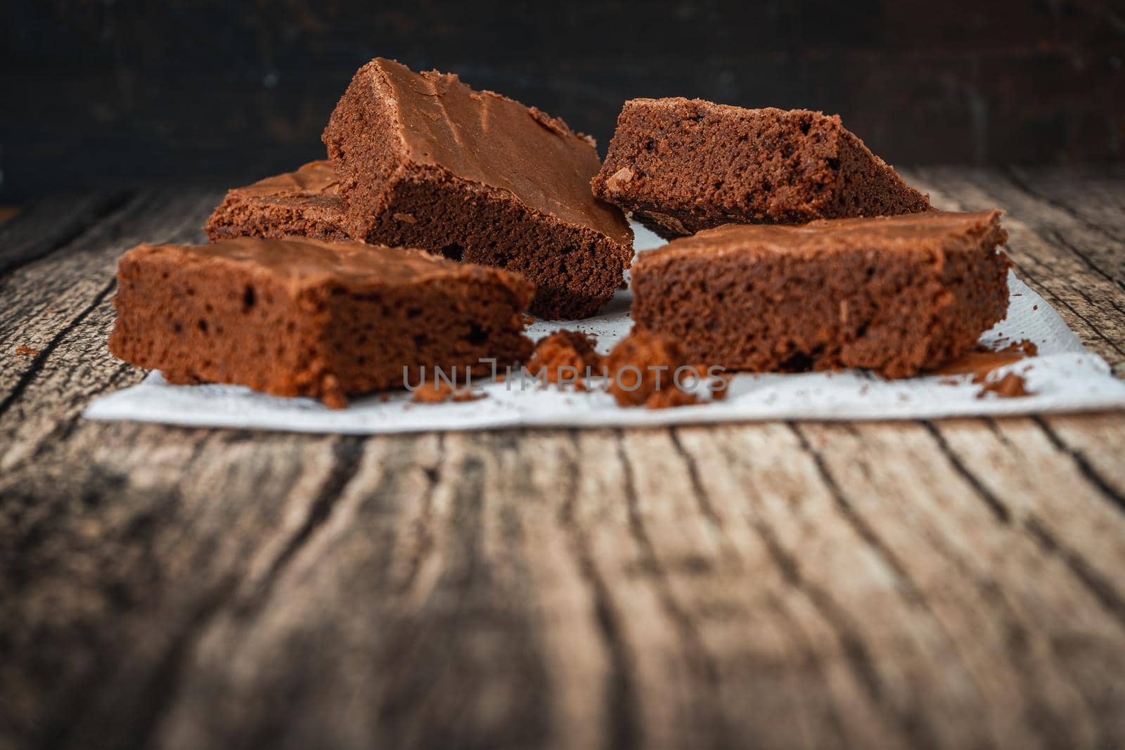 Homemade chocolate brownie squares on a table. Normal View.