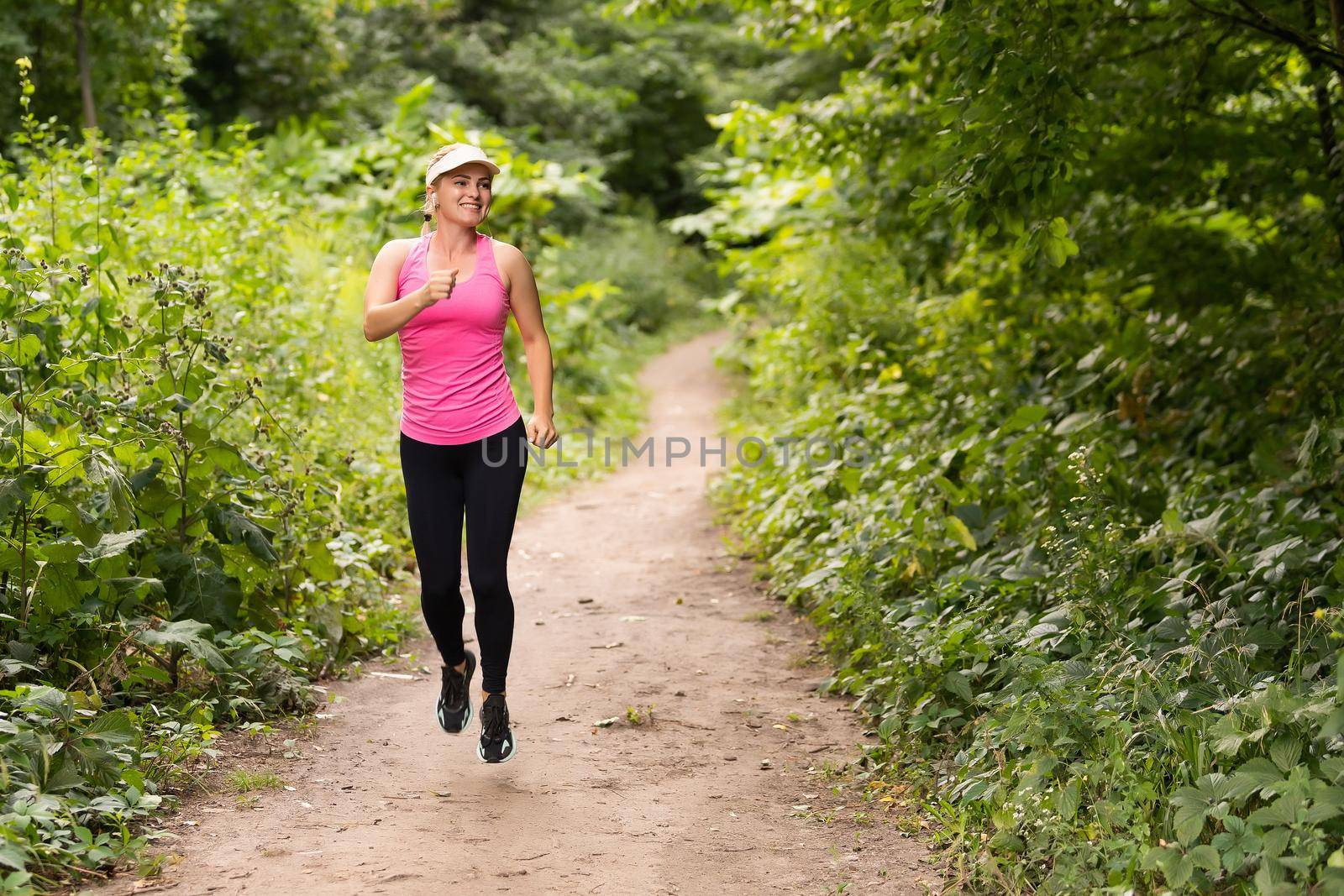 Running woman. Female Runner Jogging during Outdoor Workout in a Park. Beautiful fit Girl. Weight Loss