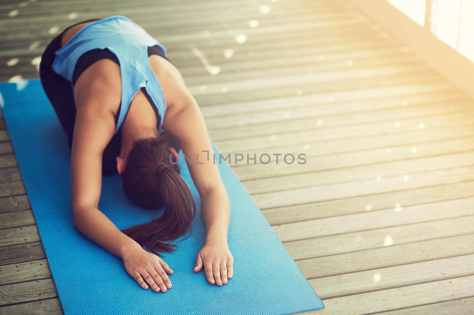 Cropped shot of a young woman practising yoga.