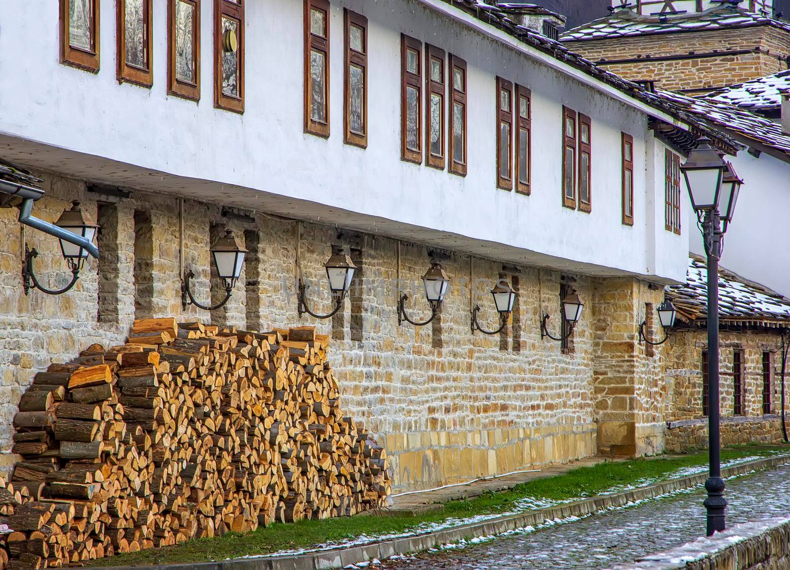 old stone house with ready firewood