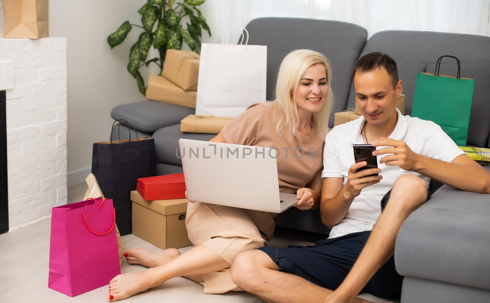 Young couple shopping online with laptop