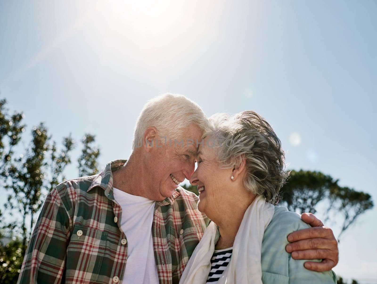 Shot of a happy senior couple relaxing together outdoors.