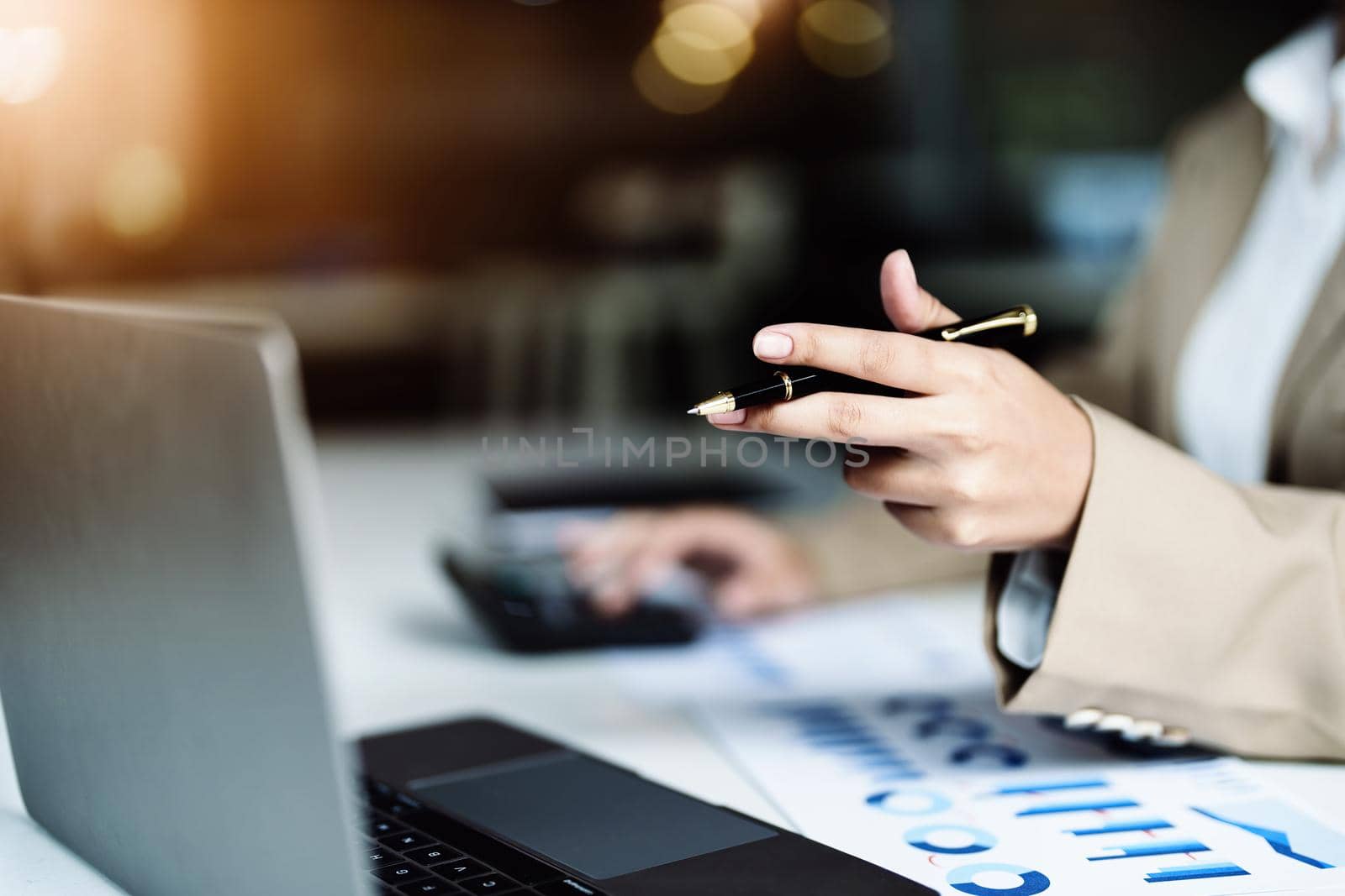 Data analysis, roadmap, marketing, accounting, auditing. Asian business woman holding pen and using computer in video conferencing, presenting marketing plan using statistical data sheet at work. by Manastrong