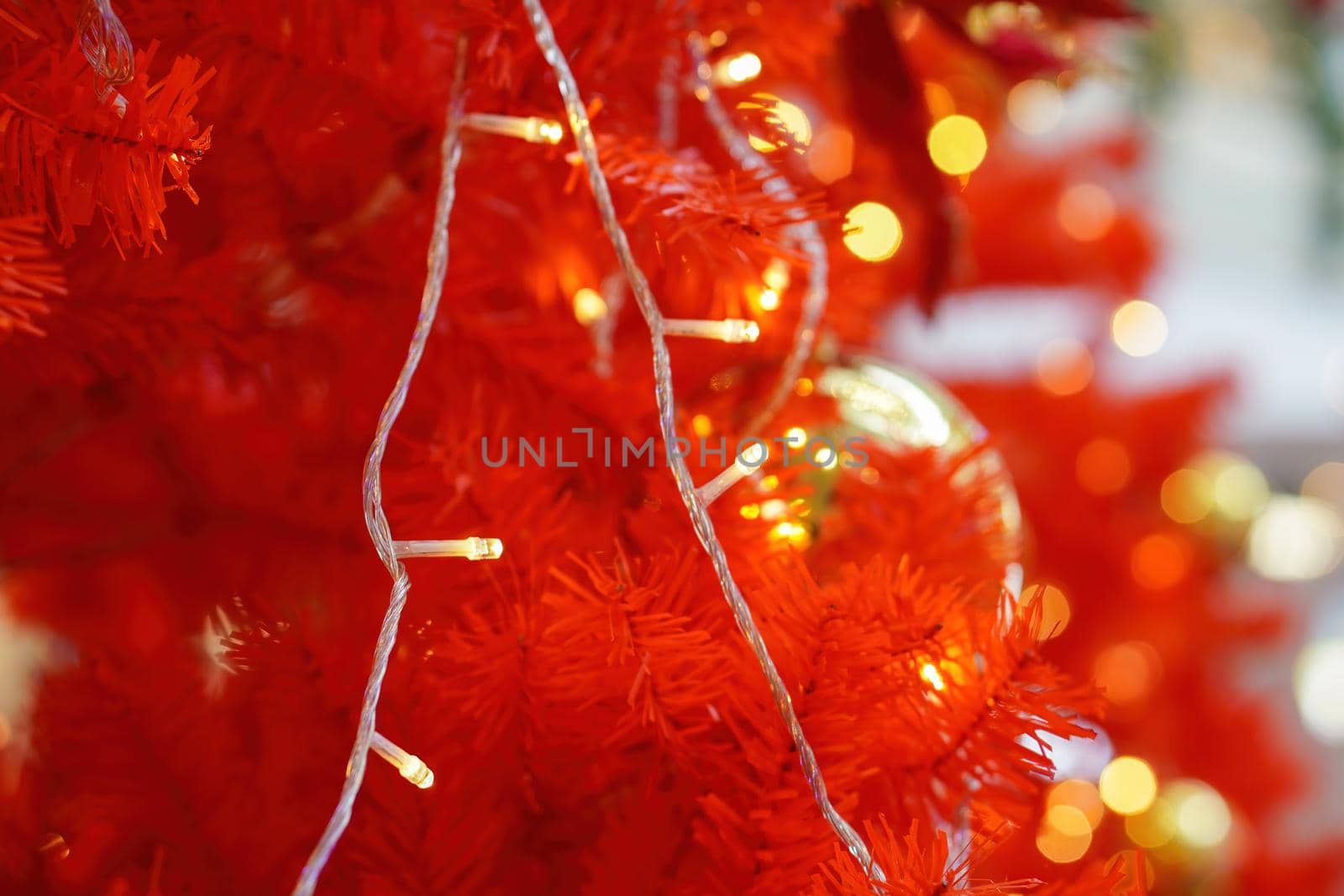 Selective focus led light decoration at red Christmas tree