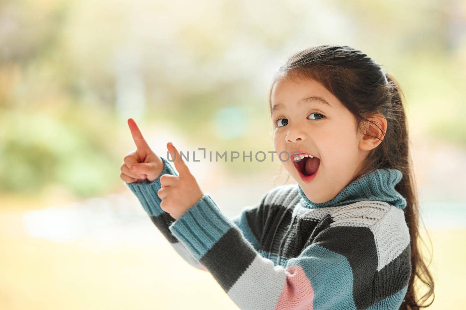 I want one of these. Shot of an adorable little girl at home. by YuriArcurs