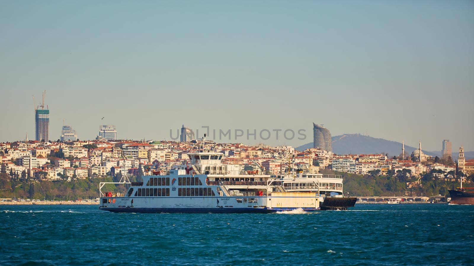 Istanbul, Turkey - 1 April, 2017: Passenger ship crossing Bosporus by sarymsakov