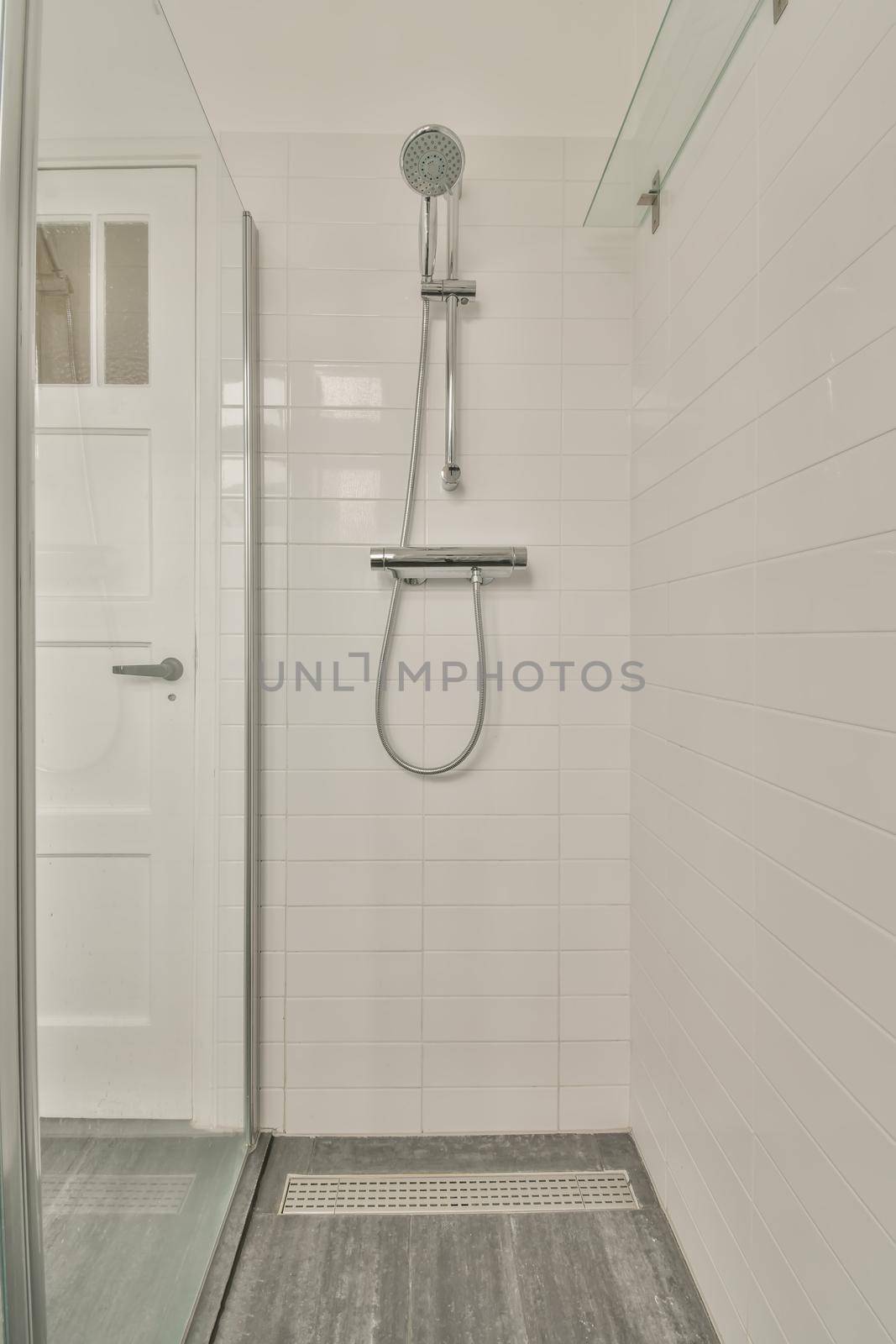 The interior of the bathroom in white of a modern house with shower