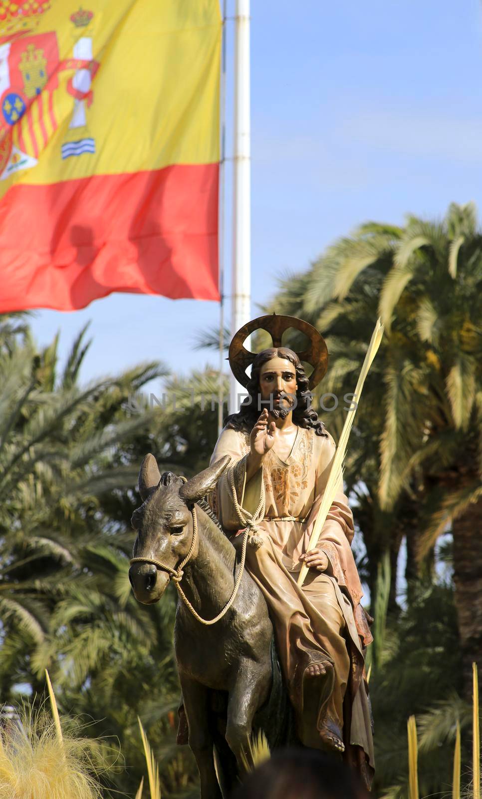Jesus Christ and Spanish Flag in the Palm Sunday Procession by soniabonet