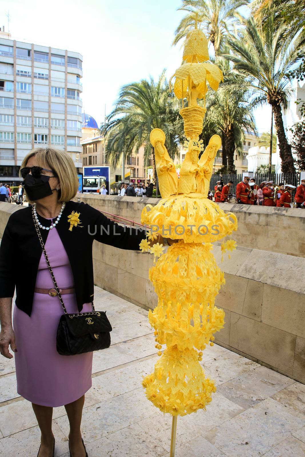 Elche, Alicante, Spain- April 10, 2022: People with white palms for the Palm Sunday of the Holy Week of Elche