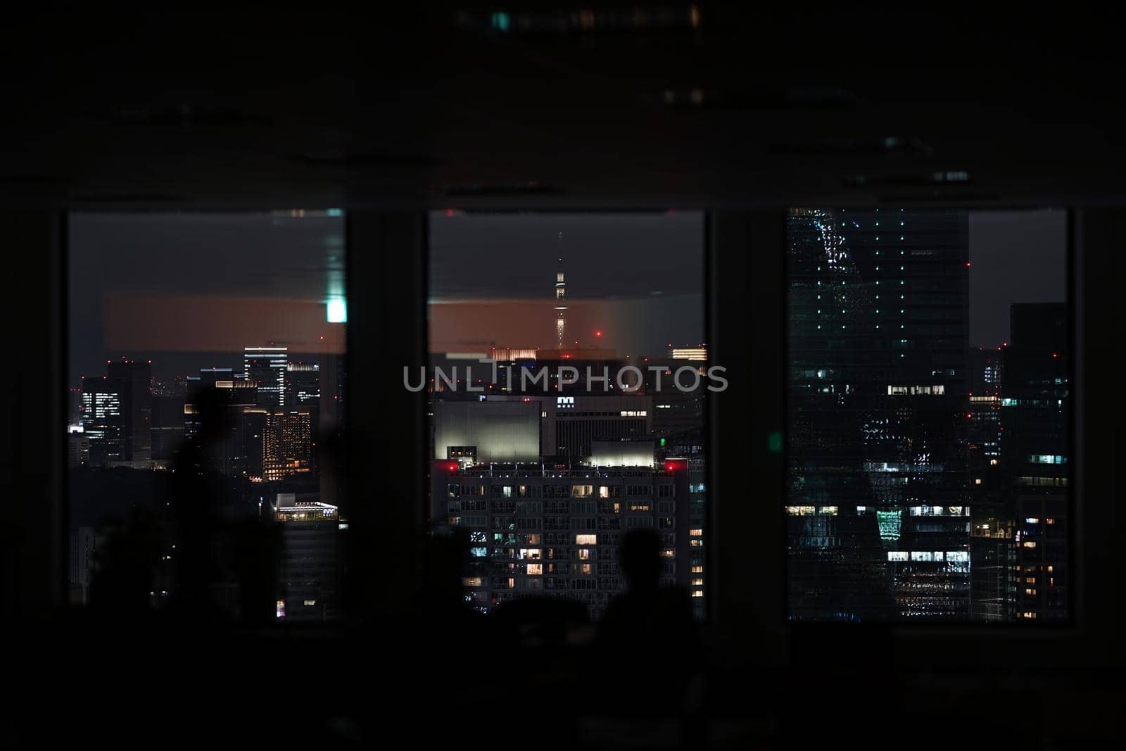 Silhouette of urban night view and people. Shooting Location: Tokyo metropolitan area