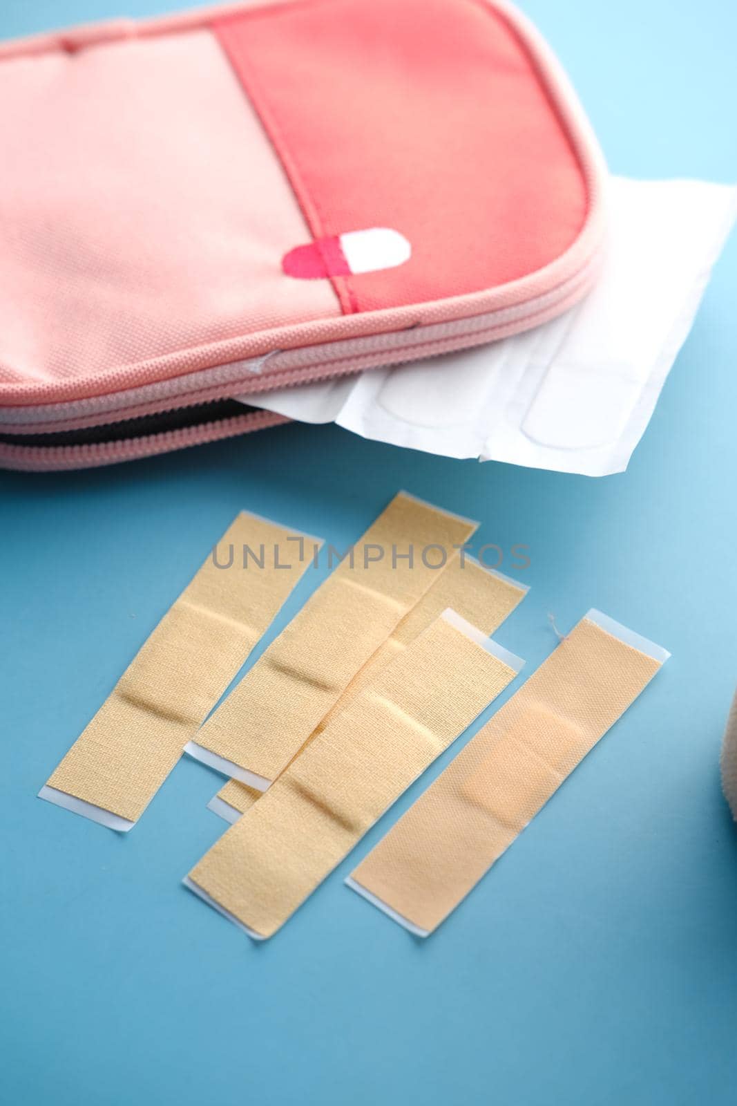 adhesive bandage and a bag on table ,