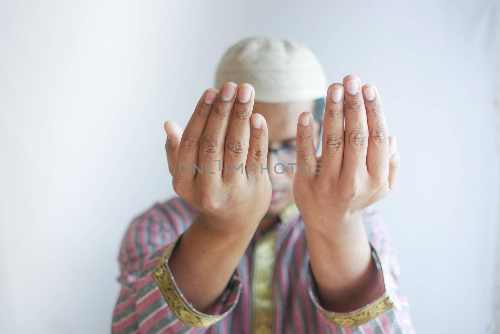 muslim man praying during ramadan .