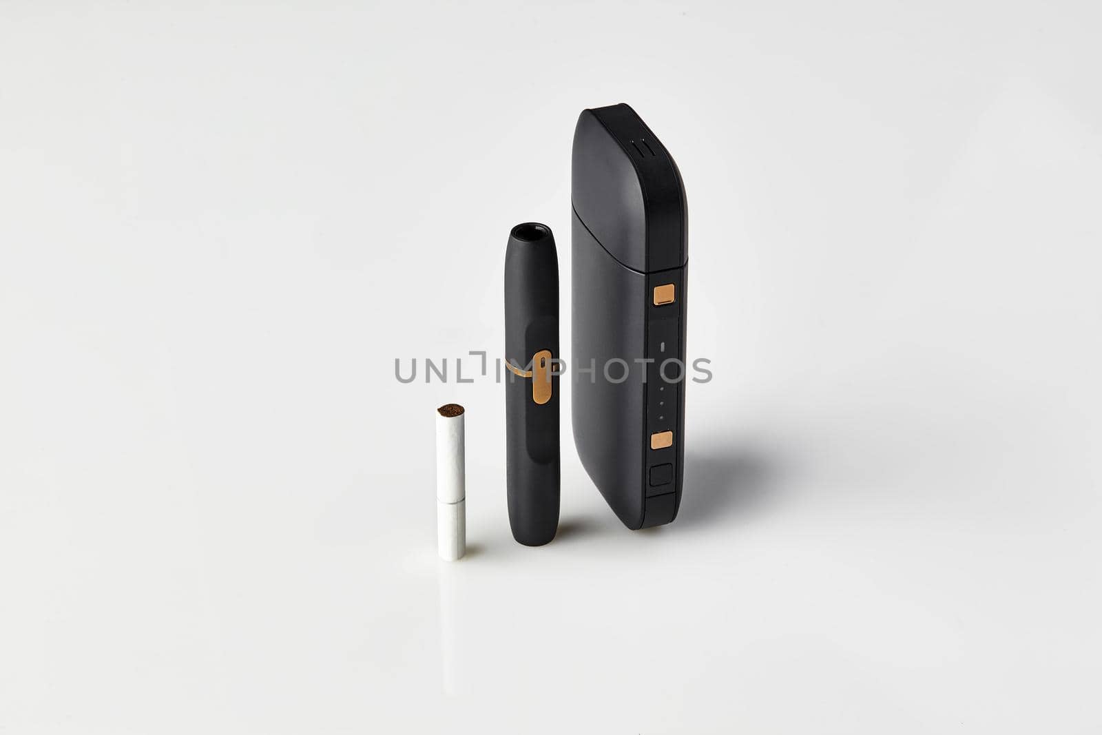 New generation black electronic cigarette, battery and one heatstick isolated on white. Hi-tech heating tobacco system. Tools used to help stop smoking. Advertising area, workspace mock up. Close up