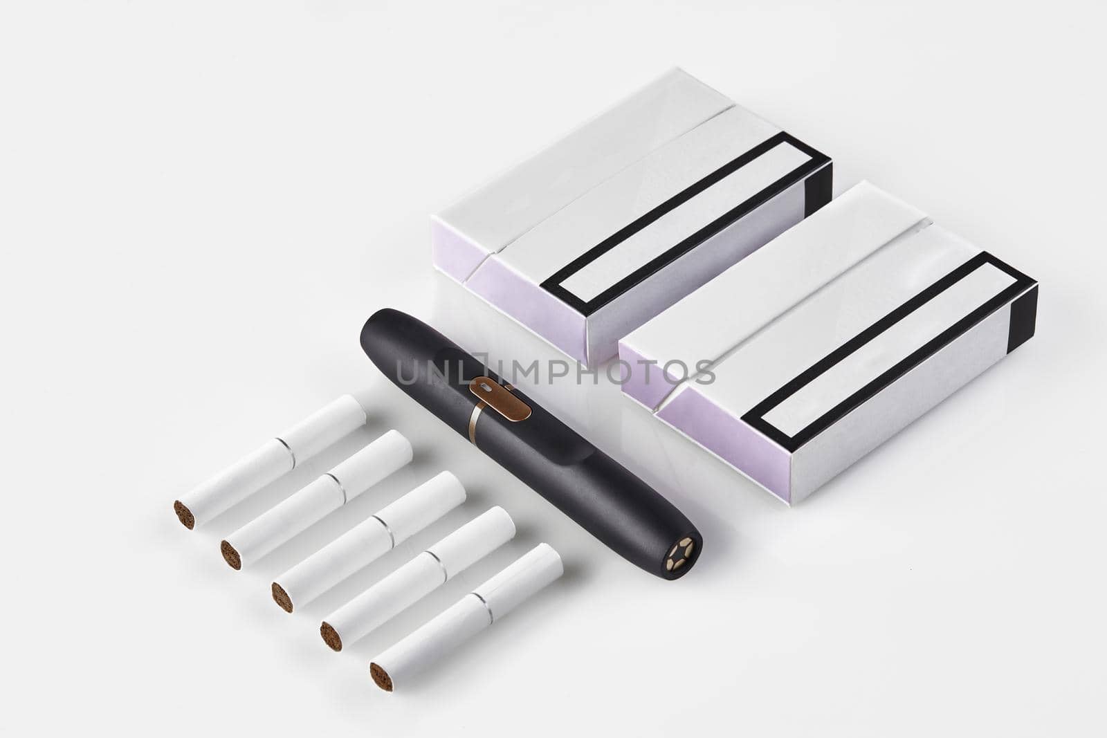 New generation black electronic cigarette, two packs with purple sides and five heatsticks isolated on white. Heating tobacco system. Close up by nazarovsergey