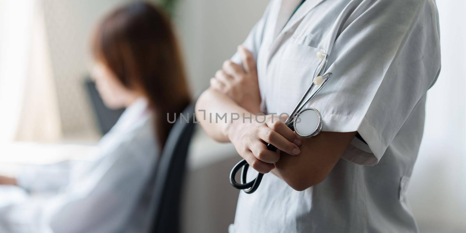 Young Doctor with stethoscope tools at clinic. Medicine and health care concept