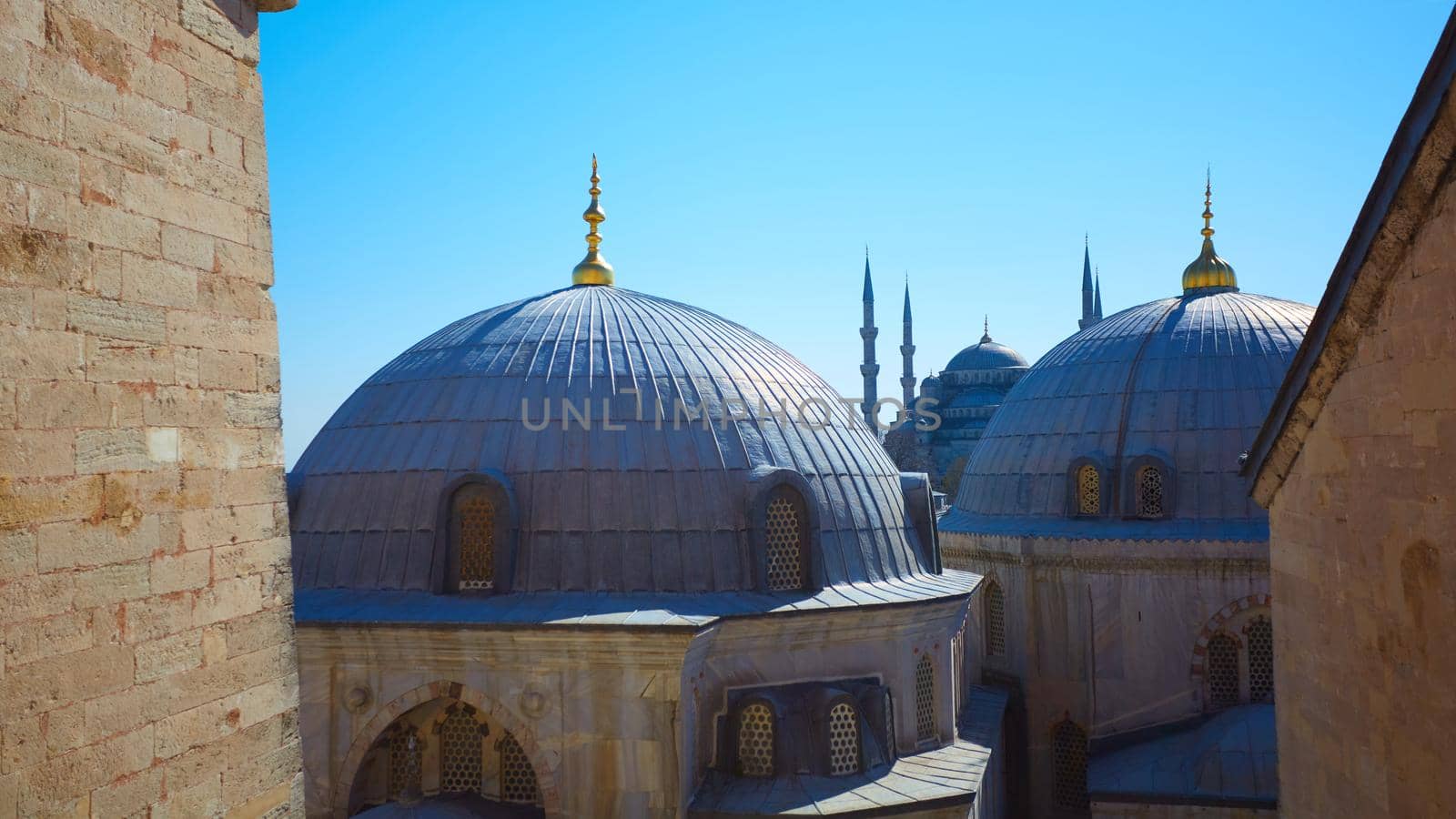 Blue mosque with Domes of the Hagia Sophia in the foreground, Istanbul, Turkey.