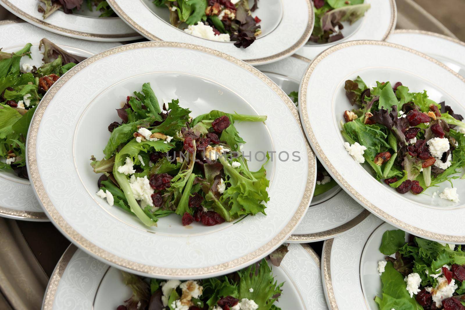 Full Frame Image of Garden Salads with Balsamic Vinaigrette Dried Cranberries Walnuts and Feta by markvandam