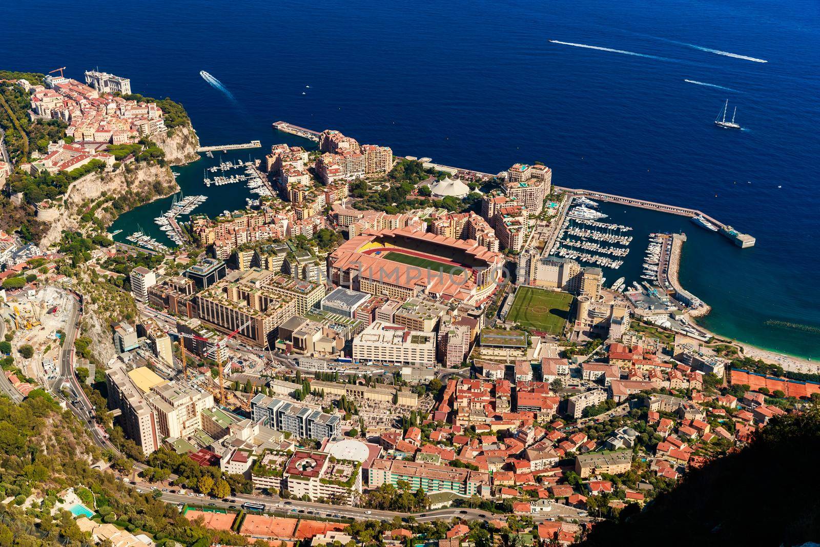 Aerial view of port Cap Dail at sunset, France, a lot of boats are moored in marina, view of city life from La Turbie mountain, mega yachts. High quality photo