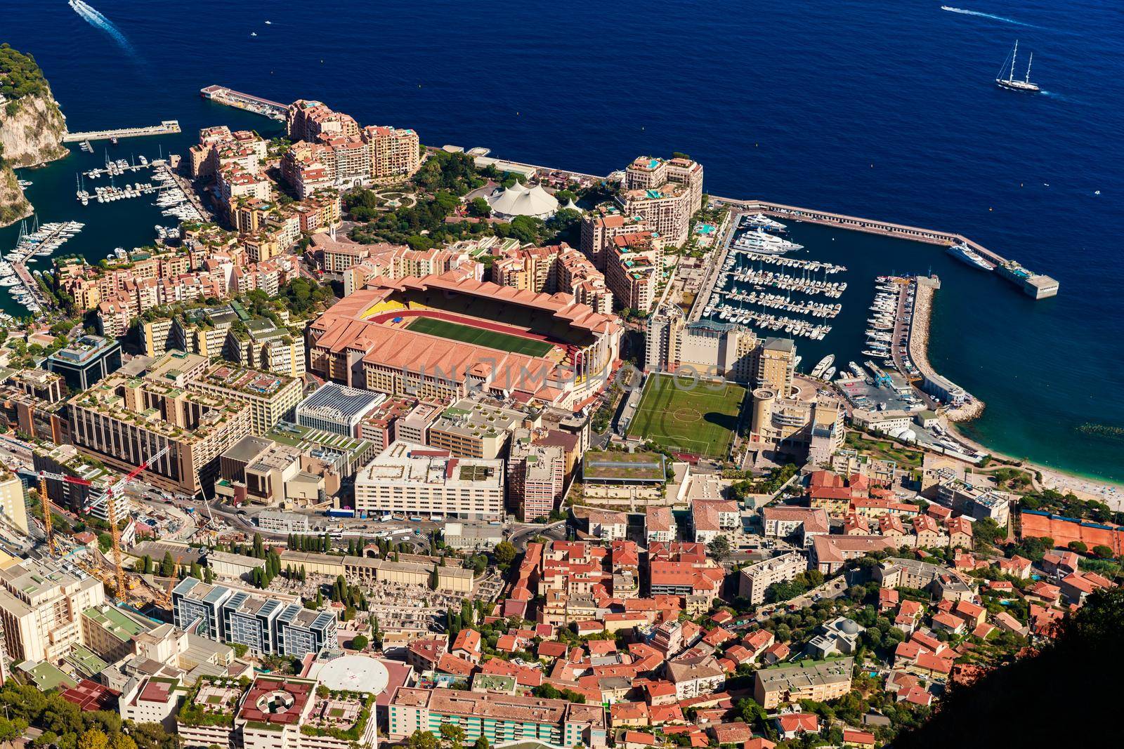 Aerial view of port Cap Dail at sunset, France, a lot of boats are moored in marina, view of city life from La Turbie mountain, mega yachts. High quality photo