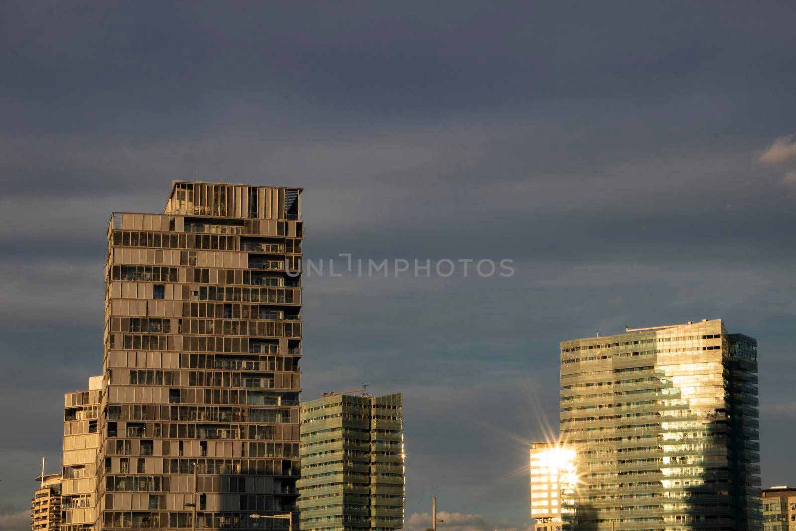 Barcelona cityscape with sun reflection by ValentimePix