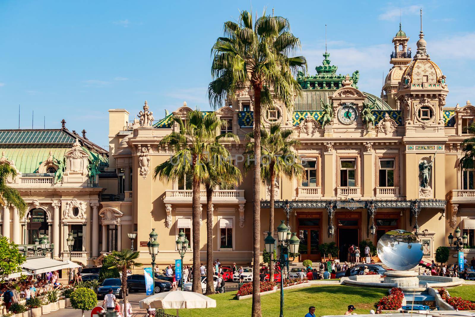 Monaco, Monte Carlo, 21 August 2017: Casino at sunset, mirror monument, a lot of tourist, architecture of principality. High quality photo