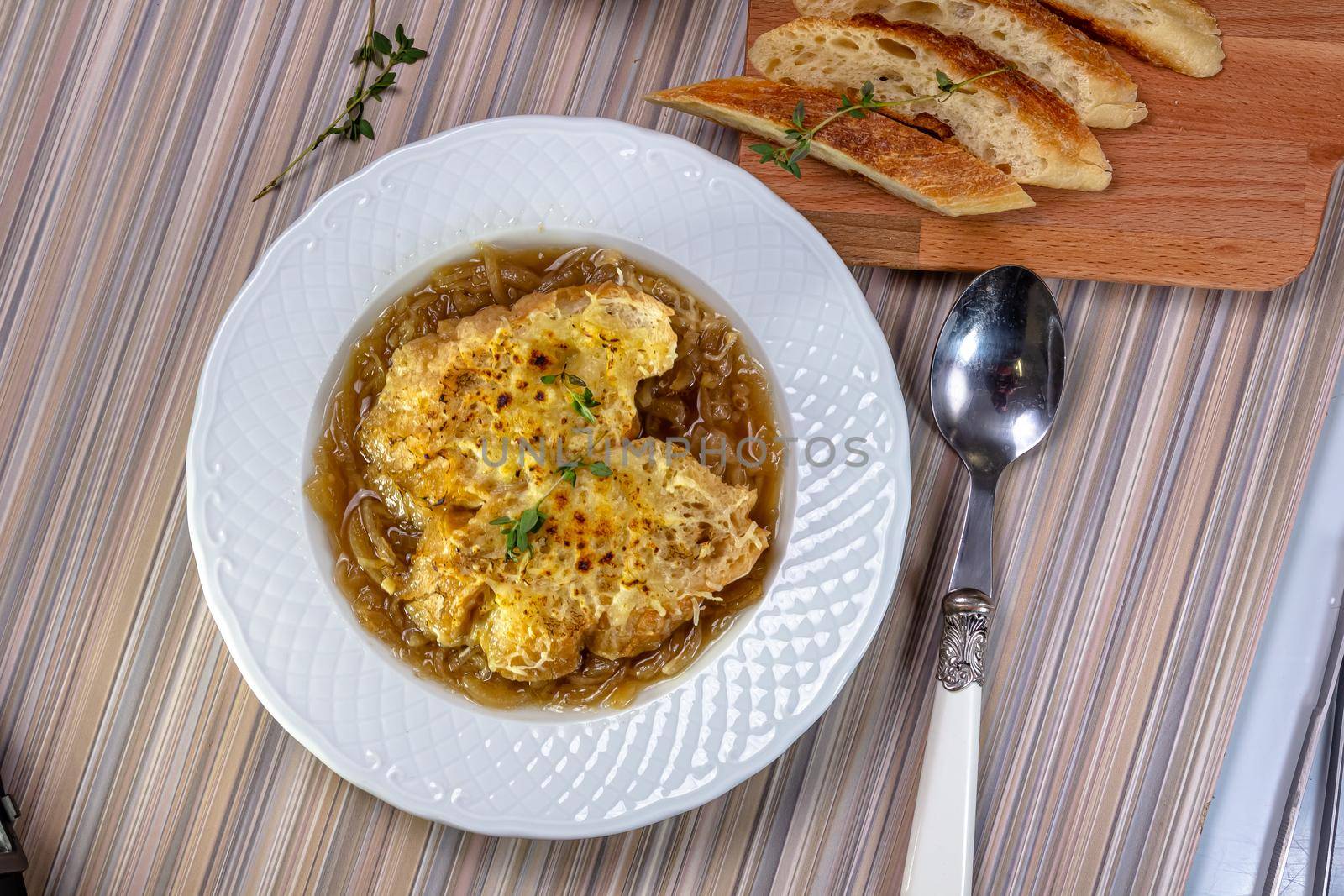 Classic French onion soup baked with cheese croutons by Milanchikov