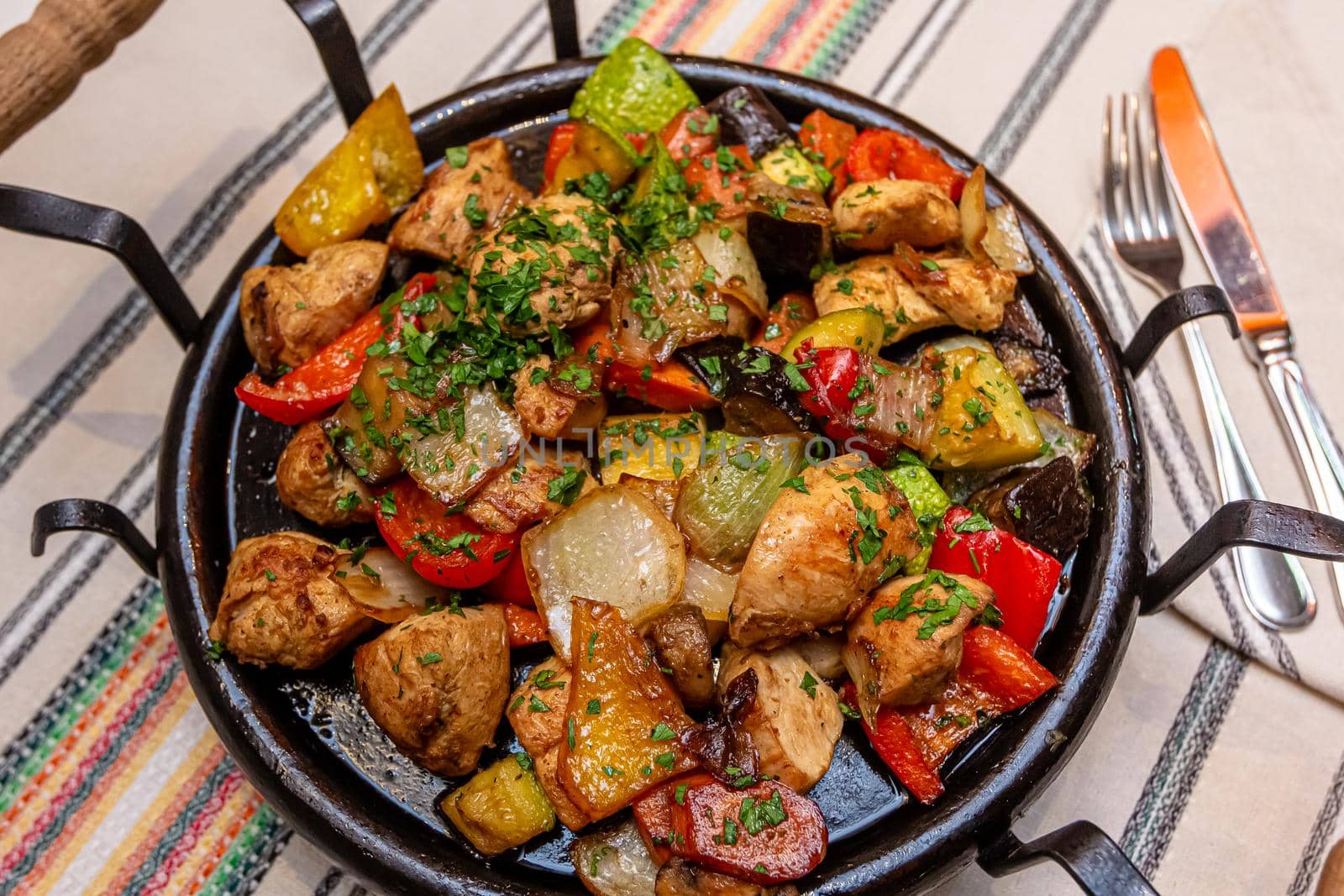 Pan-fried potatoes, meat and vegetables for a large company by Milanchikov