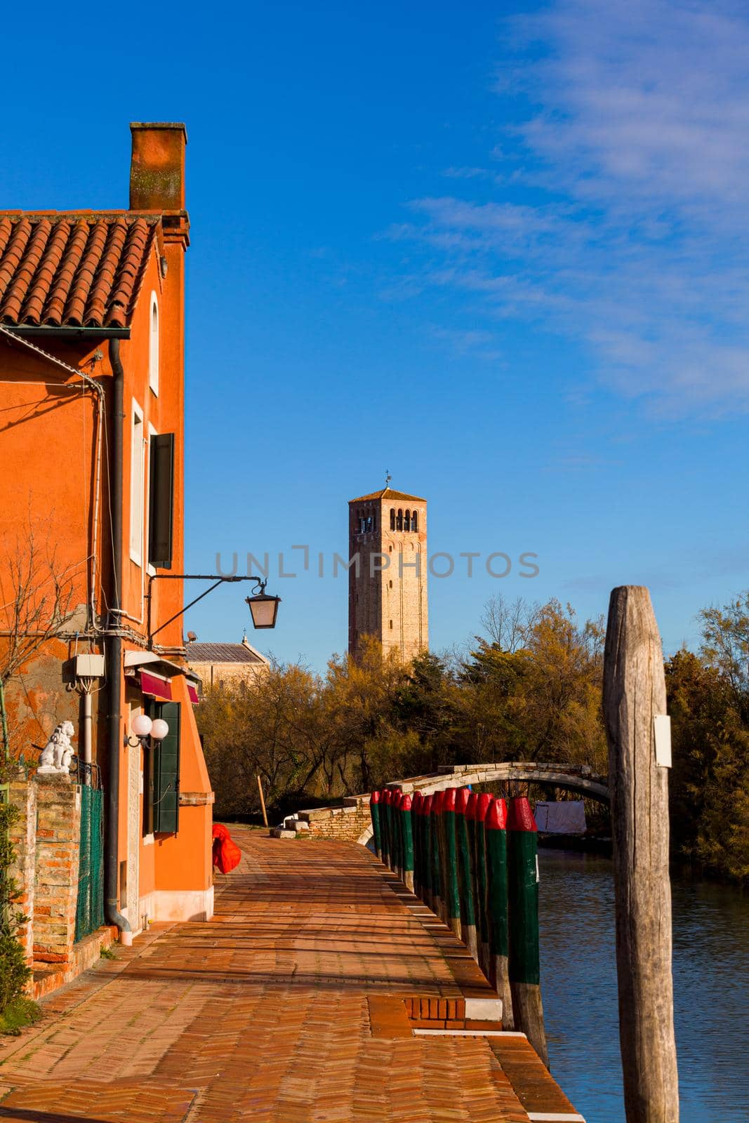 View of the Devil's Bridge and the bell tower on the island of Torcello by bepsimage