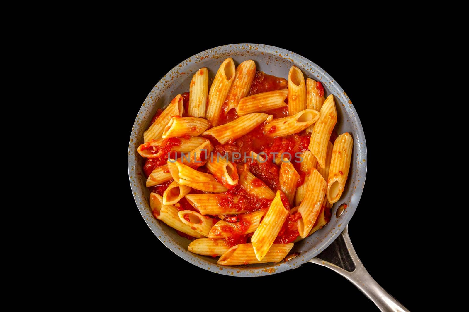 Serving of spicy savory italian penne pasta garnished with fresh basil and topped with grated Parmigiano-Reggiano, or parmesan, cheese