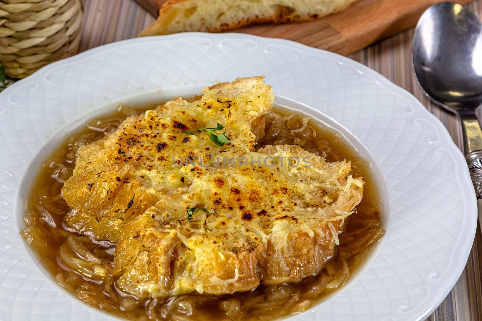 Classic French onion soup baked with cheese croutons by Milanchikov