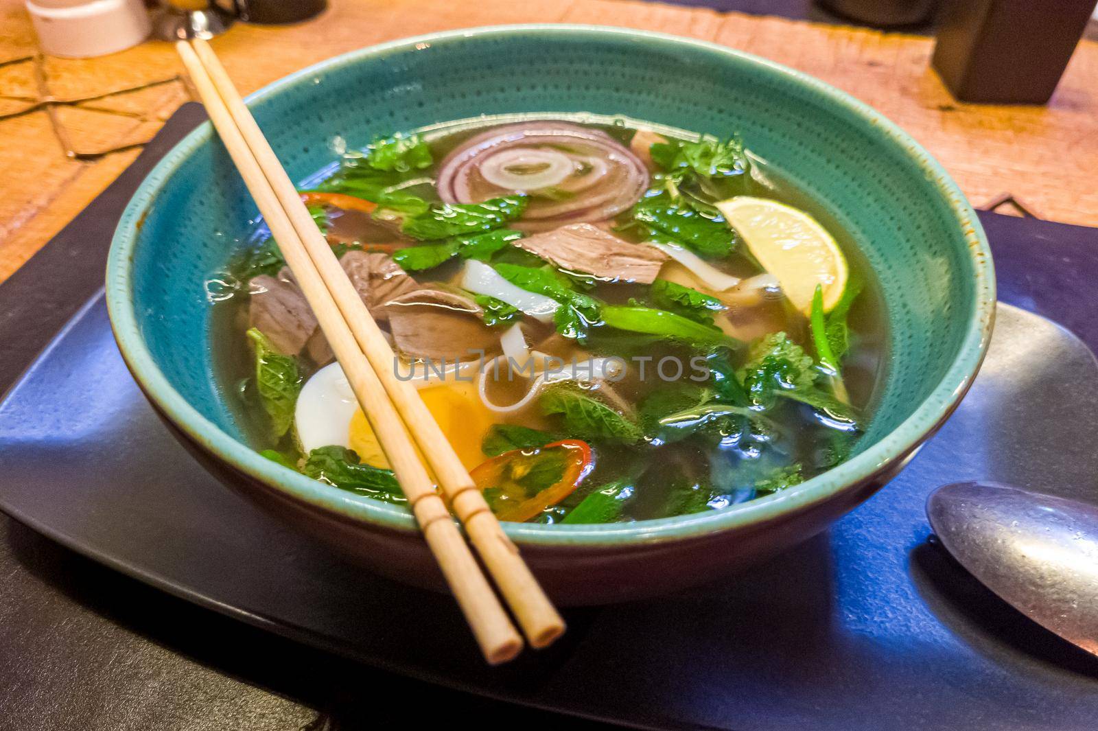 Asian soup with beef, noodles and egg, similar to pho bo or ramen.