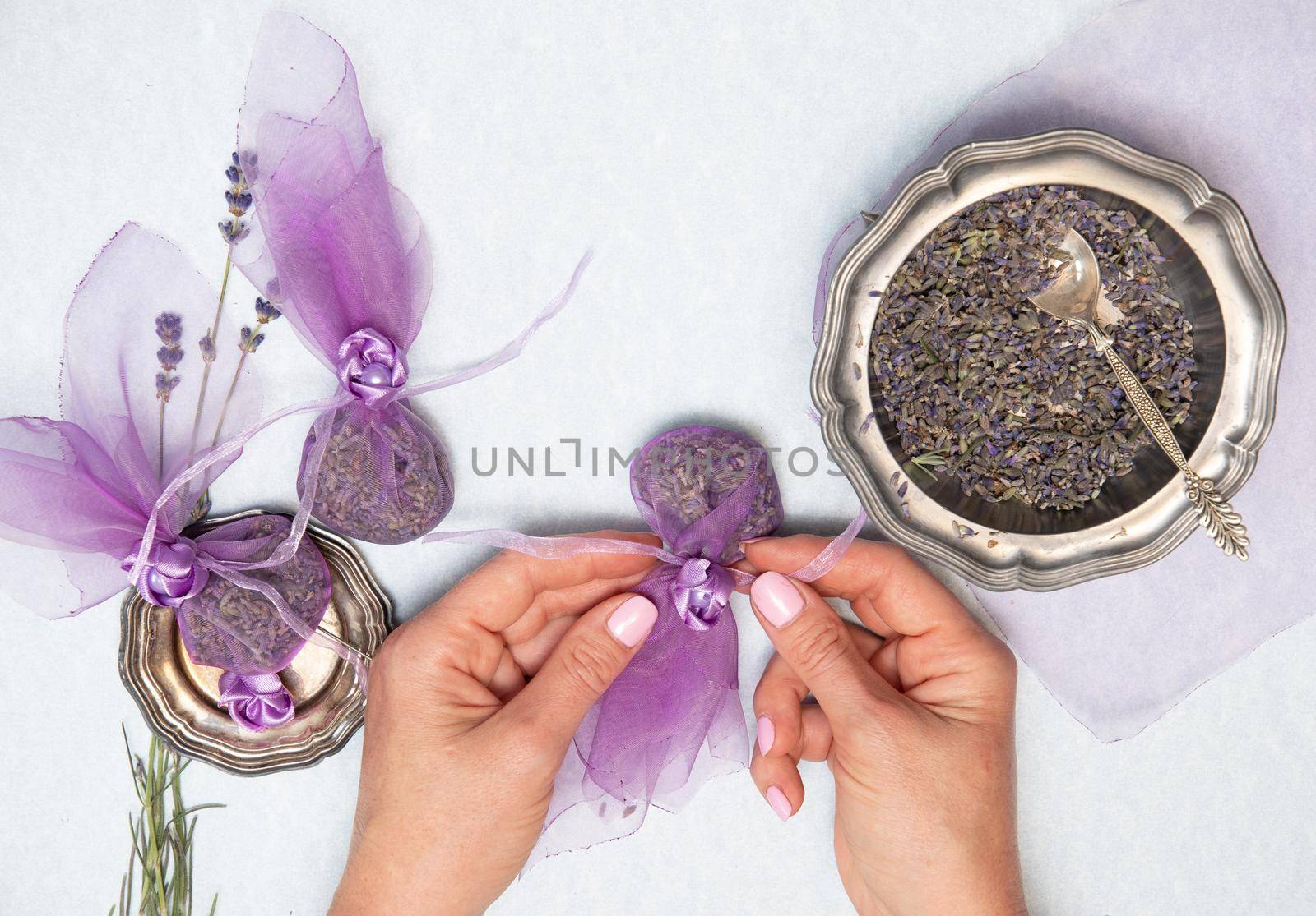 handmade lavender sachet DIY, step by step instructions,Female hands in the frame