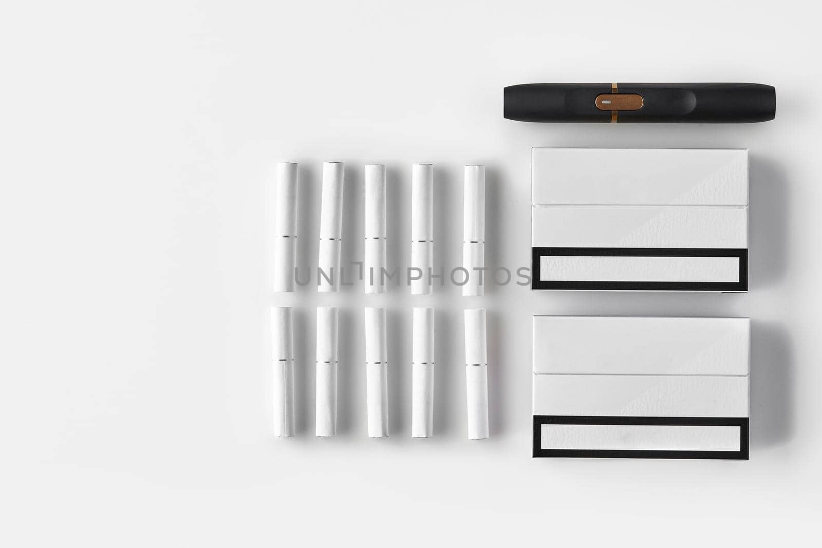 New generation black electronic cigarette, two packs and ten heatsticks isolated on white. New alternative technology. Heating tobacco system. Advertising area, workspace mock up. Close up, flat lay