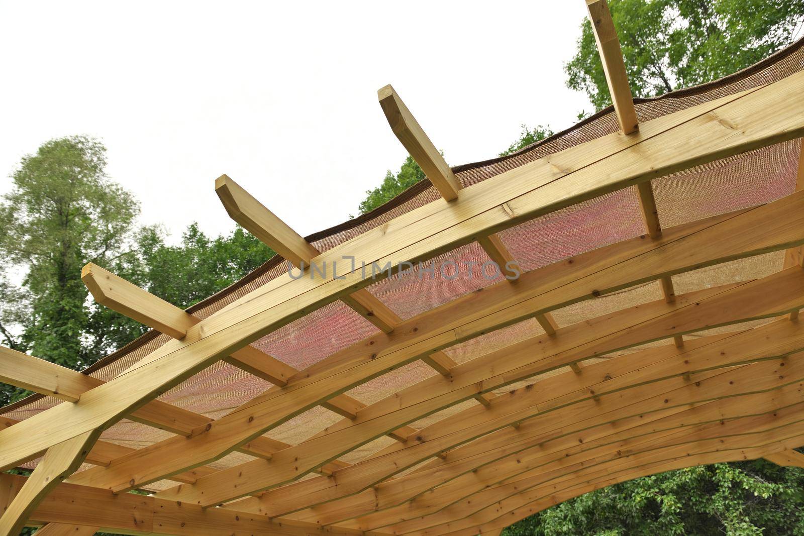 Underside of a Finely Crafted Pergola Roof with Burlap or Canvas Covering to Provide Shade. High quality photo