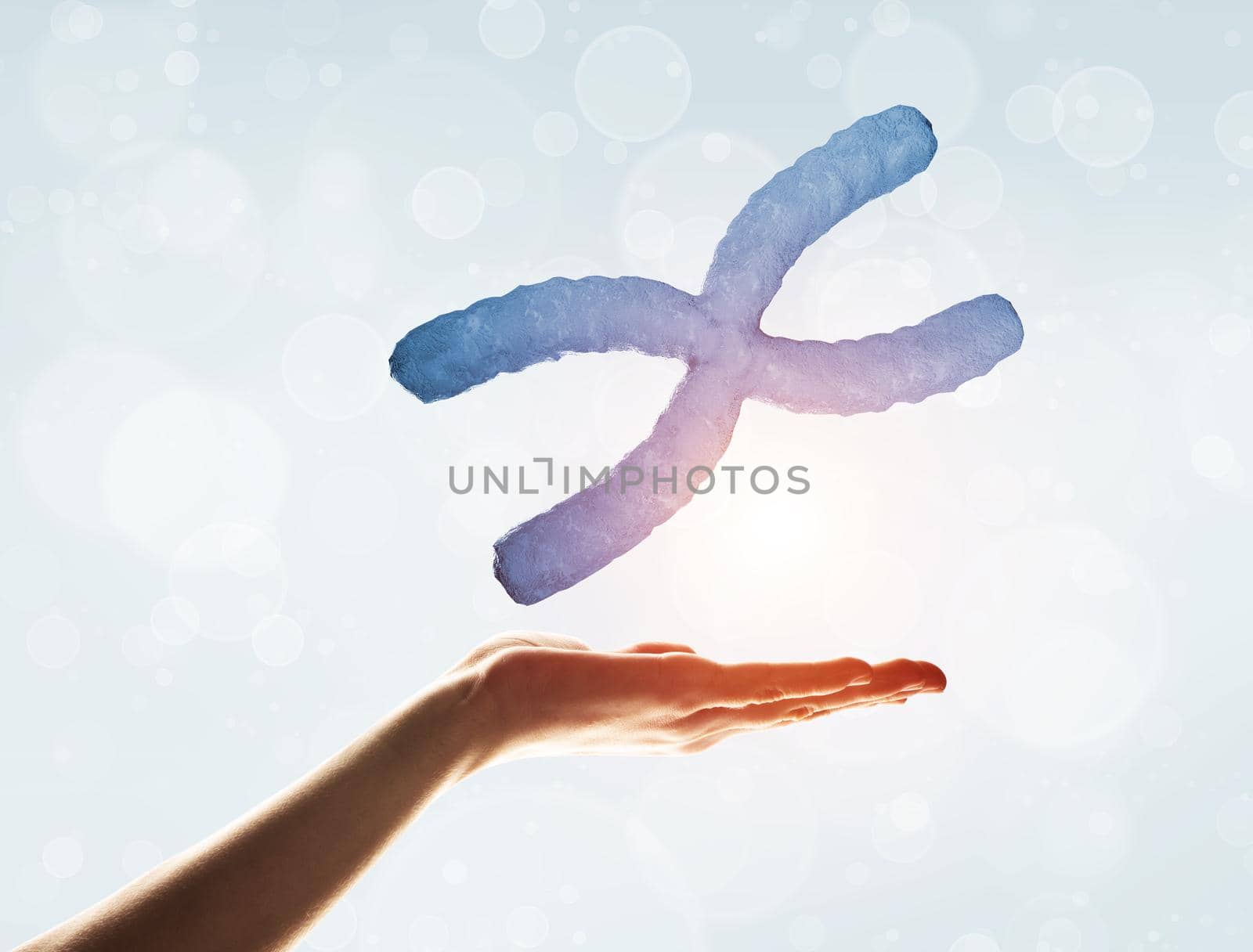 Close of human hand showing DNA molecule bokeh background