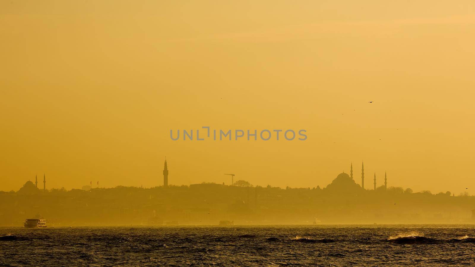 Istanbul beautiful silhouette at sunset on the bosphorus.