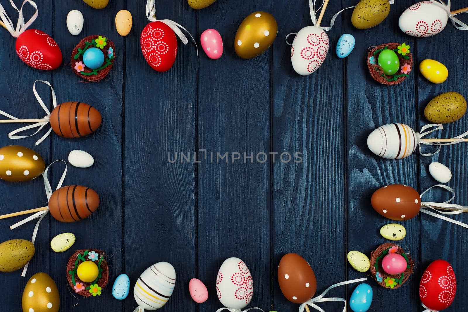 Easter eggs on wooden background . Blue wooden background. The minimal concept. Top view. Card with a copy of the place for the text.