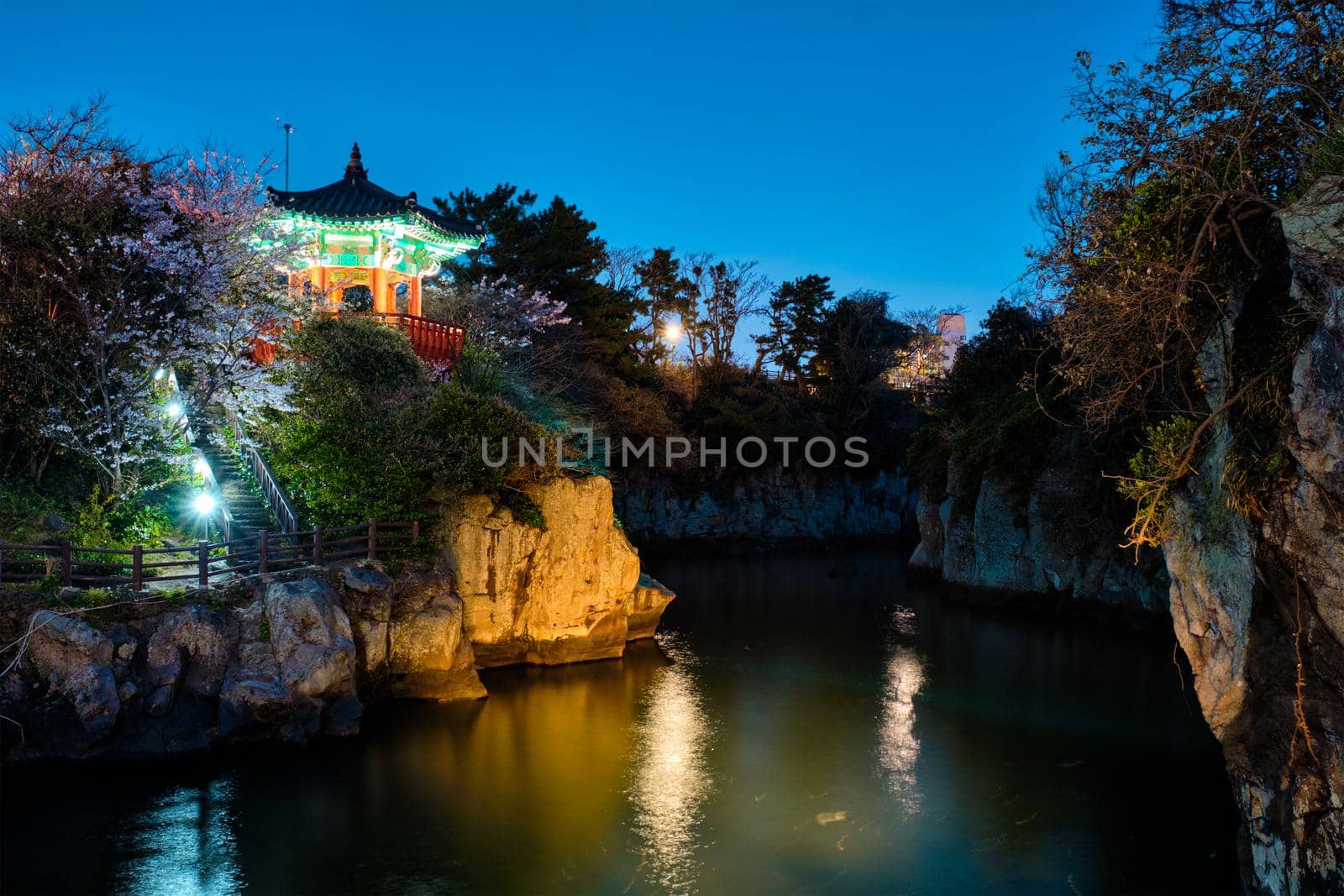 Scenic Yongyeon Pond with Yongyeon Pavilion illuminated at night, Jeju islands, South Korea