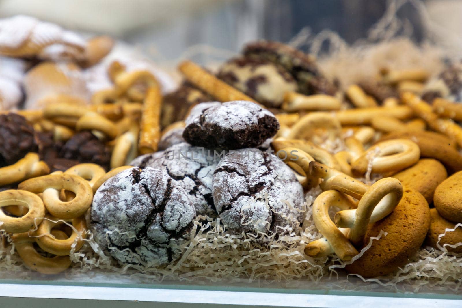 Various cookies and pastries are in the window of the confectionery shop by Milanchikov